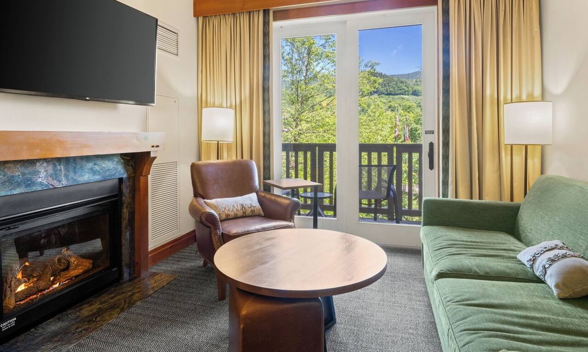 Stowe Area Condo | 2BR Spruce Peak condo with mountain views, fireplace, pool & hot tub