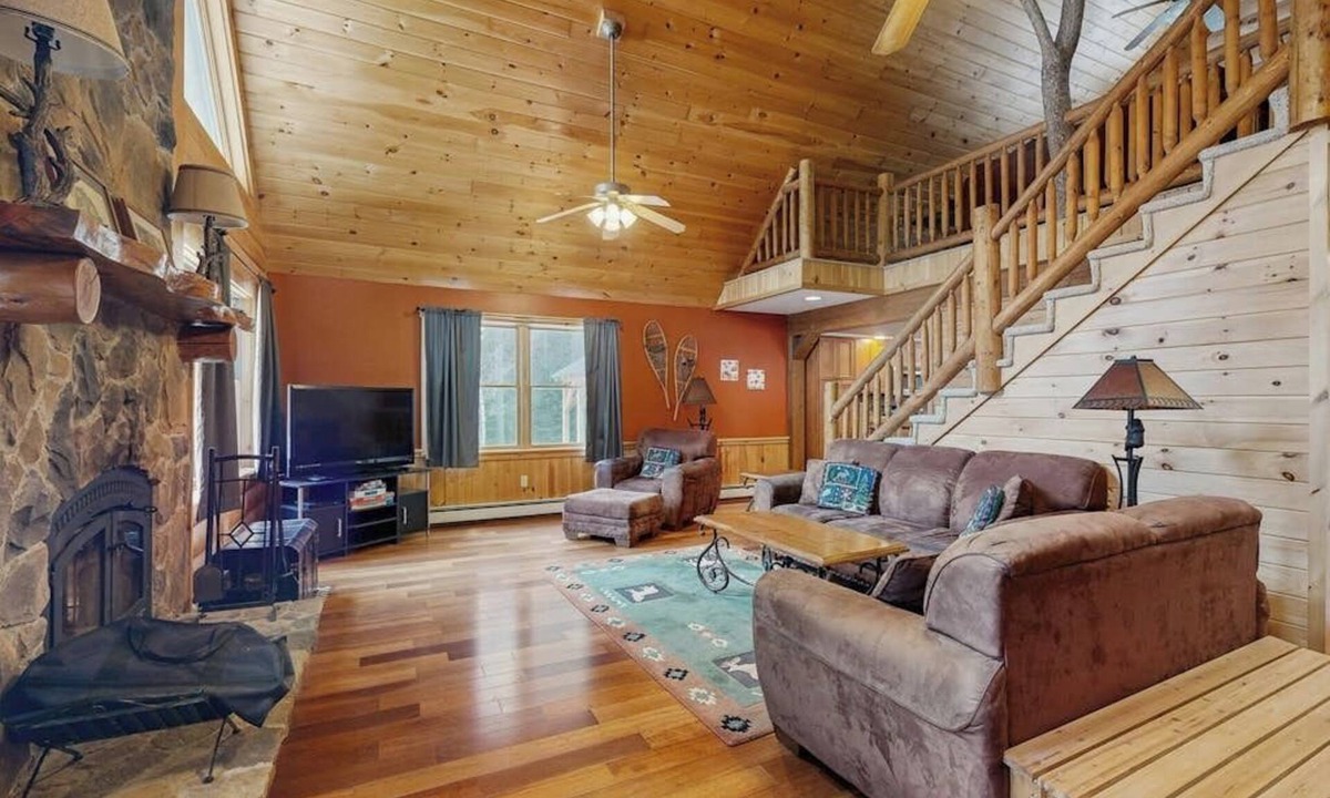 Sunday River Area House | Beautiful log cabin with nearby skiing, large living spaces, and outdoor patio