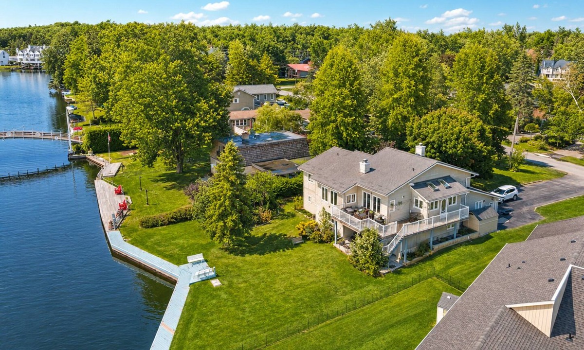 Lagoon City Cottage | Canalside summer cottage w/river views, fire table & outdoor cushioned seating
