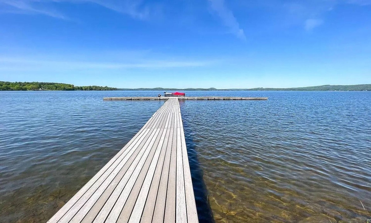 Newport Center Apartment | Cozy Lakeside Condo with Heated Pool!