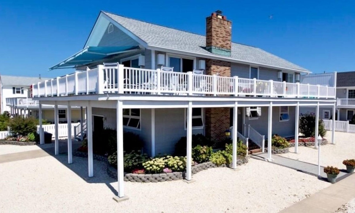 Stone Harbor House | FRIDAY TO FRIDAY RENTAL. Enjoy the beautiful sunsets - Large 2nd floor deck with pretty water views and great awnings to block the warm afternoon sun.