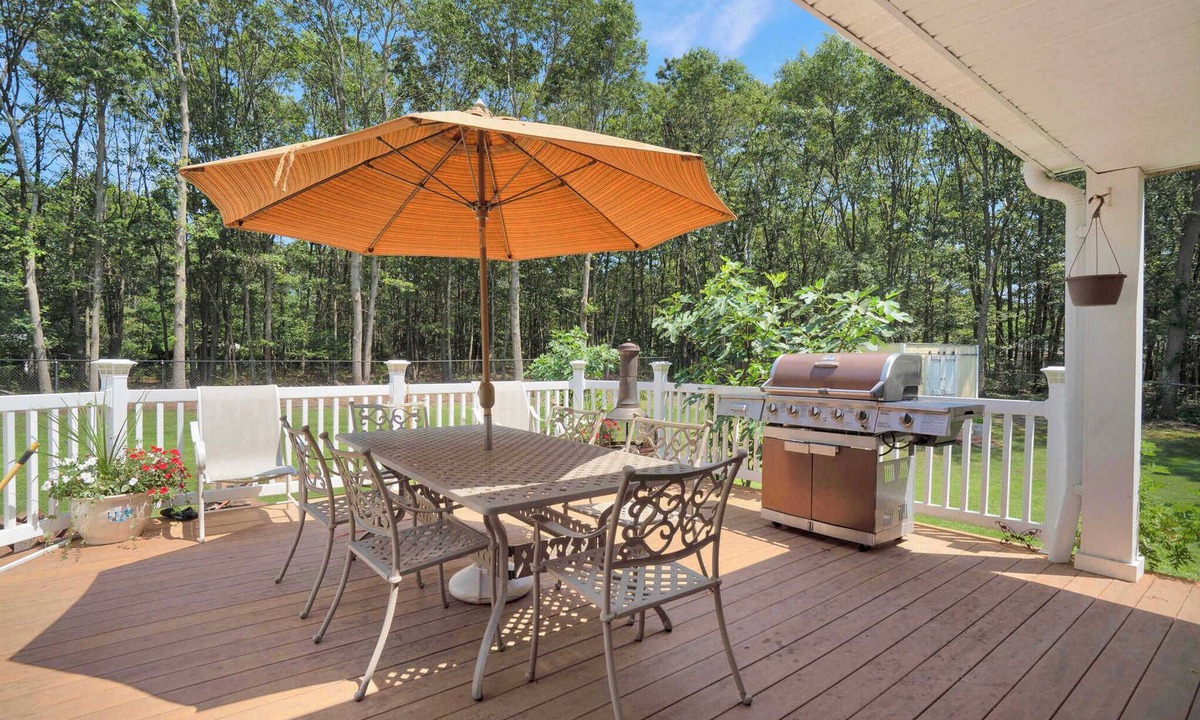 Manorville House | Manorville 4BR Home | Fenced Yard, Deck, Fireplace, Near East End Beaches