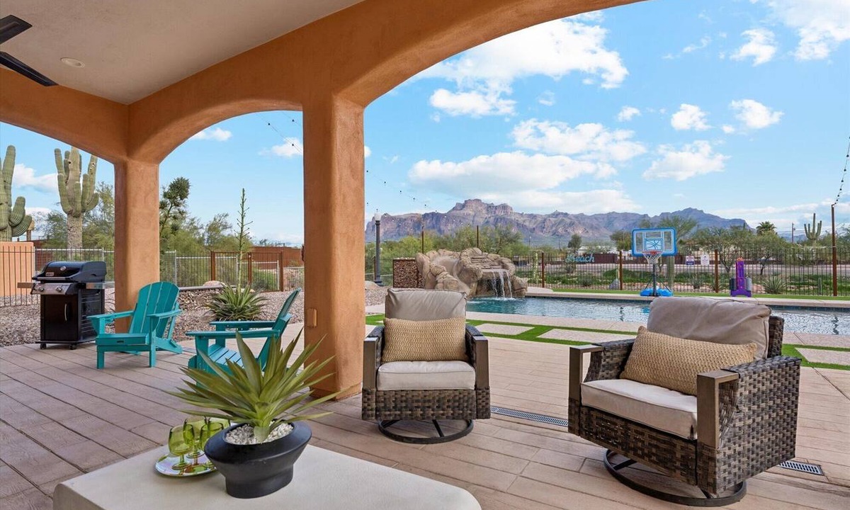 Apache Junction House | Resort-Style Backyard, Heated Pool, Waterslide, Games & Mountain Views!