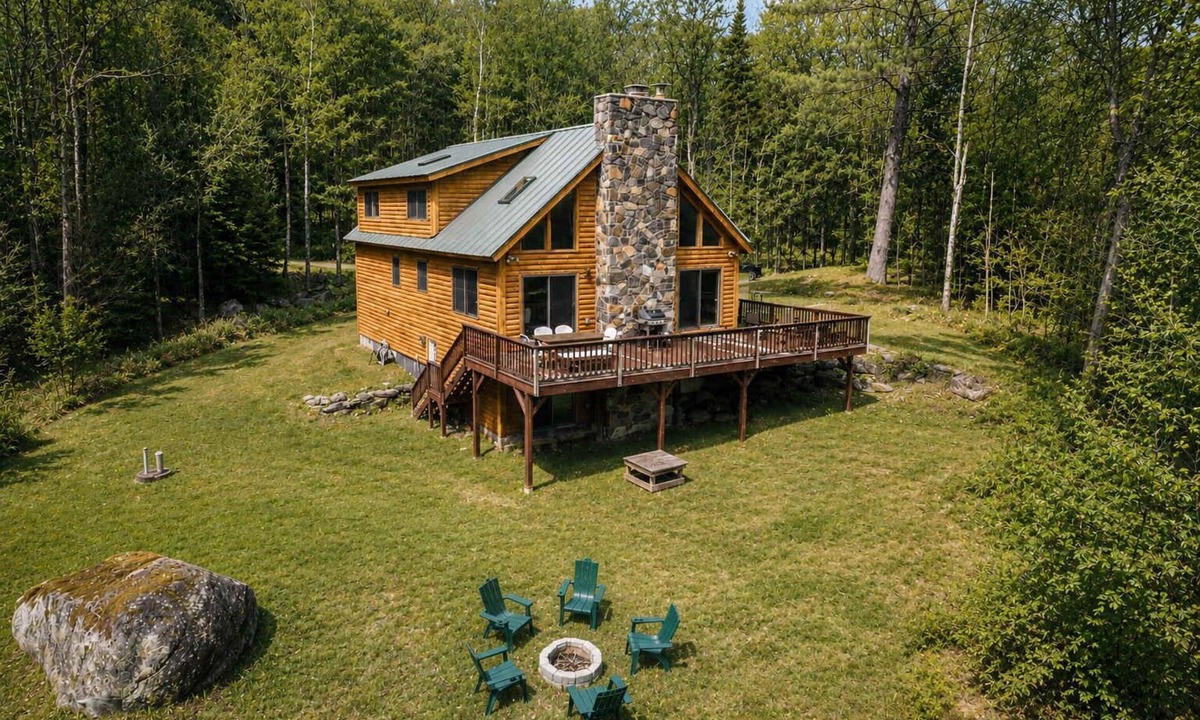 Weston House | Vermont Log Cabin, Stone Fireplace & Forest Deck
