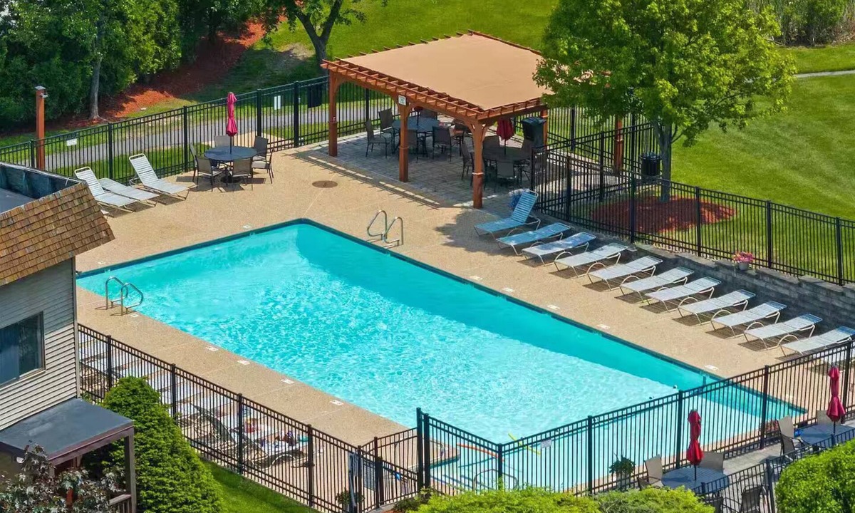 Weirs Beach Condo | Walk to Weirs Beach Boardwalk with Treetop Views of Lake Winnipesaukee!