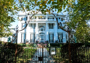 Old fashioned designer front porch living by the sea with expansive water views.