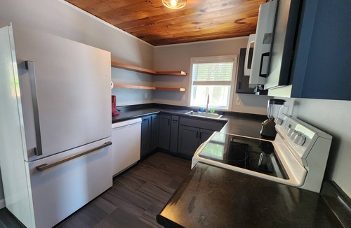 Winnisquam Condo | 2-bedroom lakefront condo in peaceful Tilton with balcony