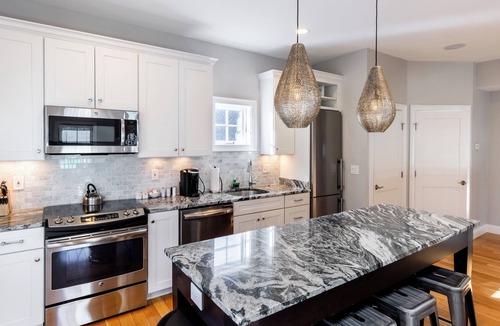 Fifth Ward Condo | 2 Decks for Entertaining, Walk To Town and Harbor