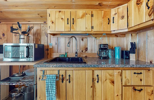 Gilford Cottage | Adorable cottage with a full kitchen, gas fireplace, pool, koi pond, & gazebo