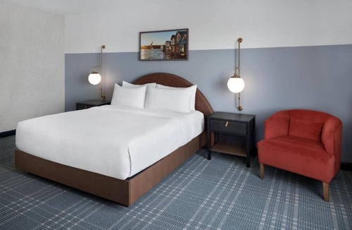 Canandaigua Hotel | Bright and Airy Lakeside Escape with Pool, Bar, and Sunset-View Seating