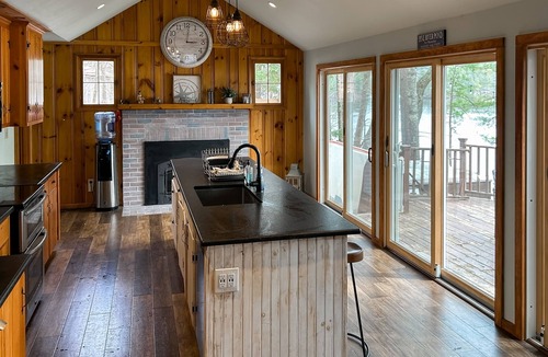 Pine River Pond House | Central lakefront house with private hot tub, dock, patio bar, & beach access