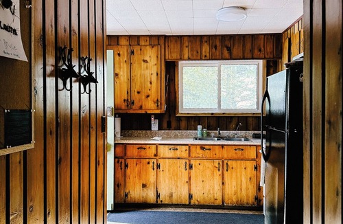 Dwight Cottage | Charming lakefront cottage with private dock, stunning sunsets & cozy wood stove