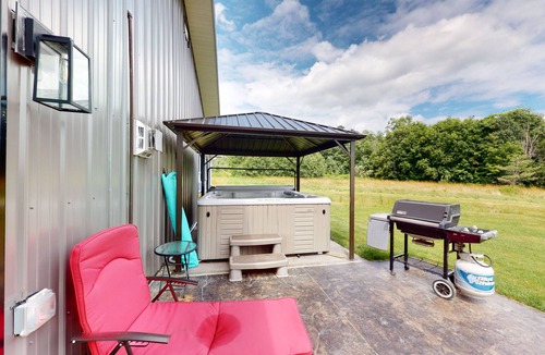 Branchport House | Charming retreat with private hot tub, fireplace, & furnished patio