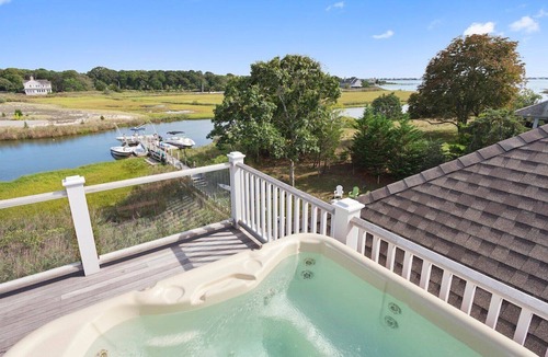 Westhampton House | Coastal traditional canal-front home with water views from most rooms....
