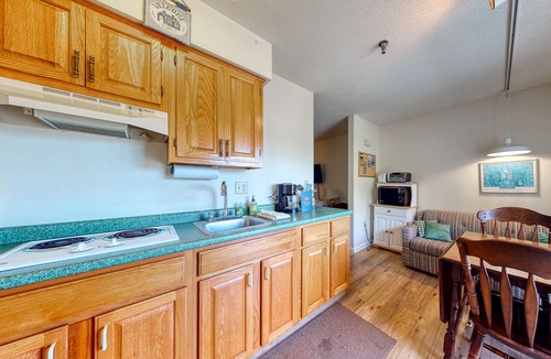 Wells Apartment | Condo by the beach with screened porch, seasonal indoor pool & basketball court