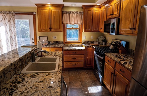 Gilford House | Cozy 4-bedroom rental property, available for you to enjoy.