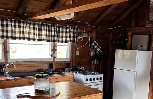 Rangeley Plantation Cabin | Cozy cabin on the water with fantastic views of Mooselookmeguntic Lake.