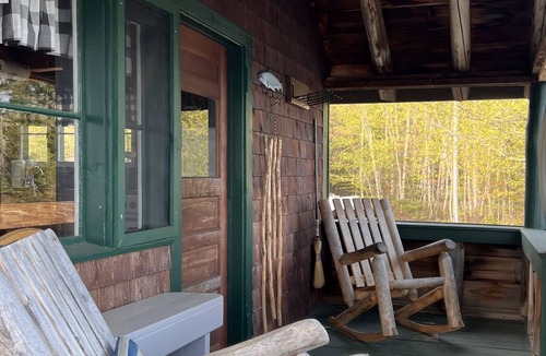 Rangeley Plantation Cabin | Cozy cabin on the water with fantastic views of Mooselookmeguntic Lake.
