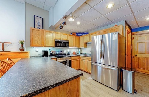 Carrabassett Valley Apartment | Cozy, ground-floor duplex retreat with direct shuttle service to Sugarloaf
