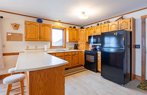 Newport Center Apartment | Cozy Lakeside Condo with Heated Pool!