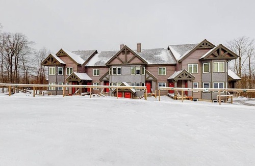 North Troy Condo | Cozy ski-in/ski-out home next to Grammy Jay trail with fireplace, mountain views