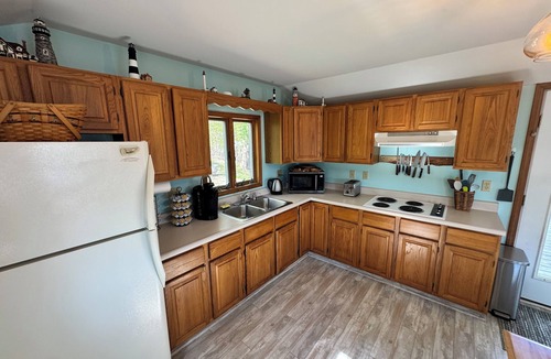 Sodus Point Cottage | Cute red cottage on the hillside overlooking Sodus Bay. Direct water access