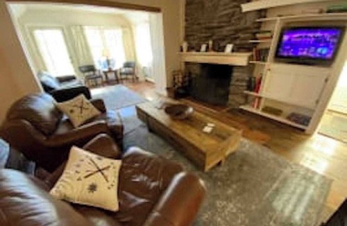 West Dover Resort | Deluxe King Suite, Living Room area w/sofa bed & fireplace, private entrance