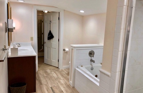 West Dover Resort | Deluxe King Suite, Living Room area w/sofa bed & fireplace, private entrance