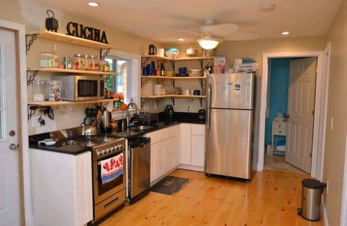 East Falmouth House | Enjoy the lake, dock, beach, large grounds, or renovated home. New ductless AC.