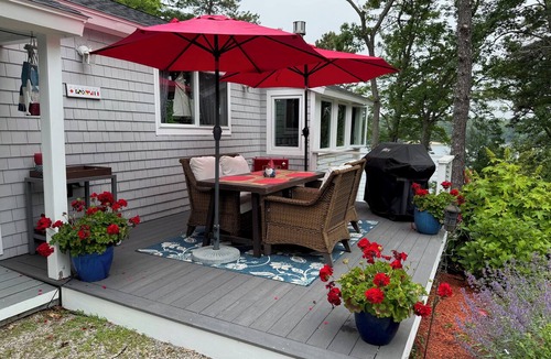 East Falmouth House | Enjoy the lake, dock, beach, large grounds, or renovated home. New ductless AC.