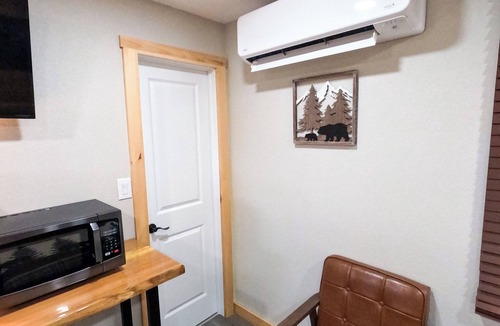 North Greece Hotel | Escape to the tranquility of our cozy cabin inn, where rustic charm meets modern comfort. Experience a home away from home ambiance.