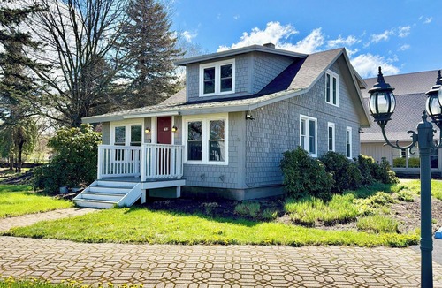 Oneonta House | Escape to this charming Carriage House in Oneonta—perfect for families or small groups. With space for 7, a beautiful landscaped yard, and easy parking, it’s the ideal home base for relaxing getaways and nearby adventures.
