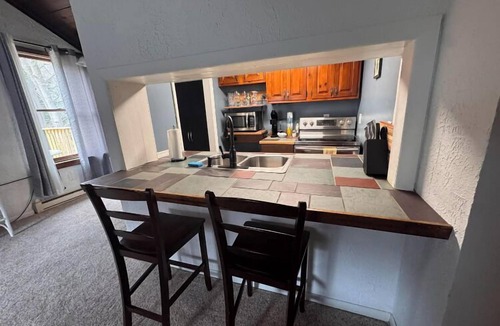 Bolton Landing Apartment | Evergreen hideaway