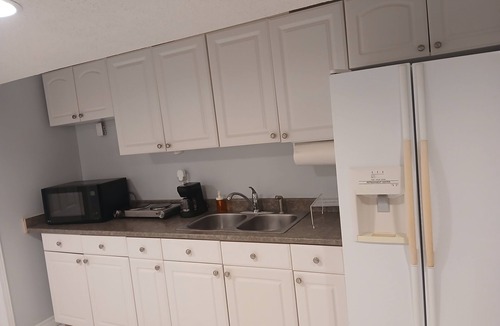 Lisgar Apartment | furnished basement studio, with1 queen bed, a kitchenette, and 1 bathroom.