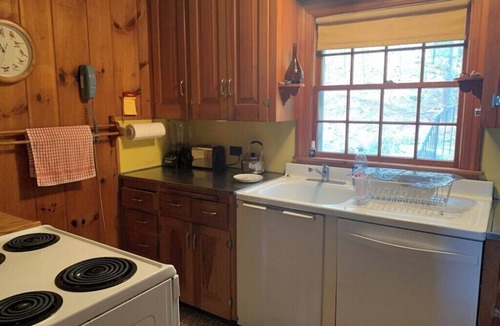 Melvin Village Cabin | Hidden Gem on Melvin Bay | Cozy Cabin Beneath the Trees
