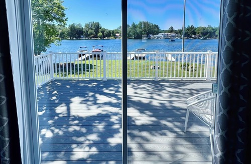 Lochmere House | Lakefront 3-bedroom Duplex on Lake Winnisquam, docks, Beach, WiFi, AC. B1A