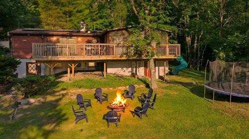 Woodridge House | Lakefront Hot Tub Retreat Gig WiFi 75 TV Dock Sleeps 16