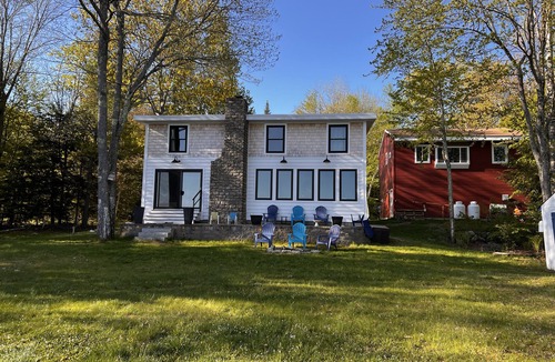 Raymond House | Lakefront Living. Kayak while bald eagles soar above and loons call out.