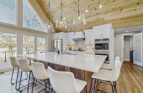 Gray House | Lakefront properties with private beach, hot tub, dock, kayaks, grill & firepit