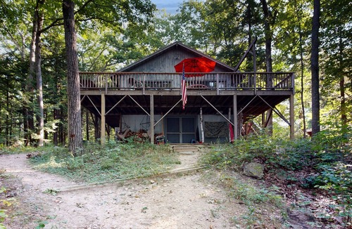 Wolfeboro House | Lakefront & ski retreat with wrap-around deck, wood fireplace, & private beach