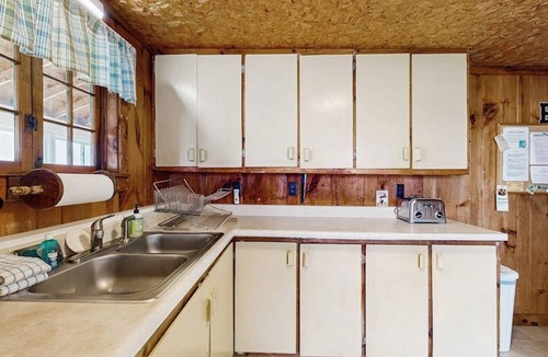 Malletts Bay House | Lakeside cottage w/mountain views, canoes, firepit, enclosed porch, bbq, beach