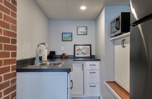 Dedham House | Light-filled lakefront home for up to 15 with private beach and dock near Acadia