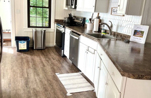 Sandown House | Luxury Lakefront Retreat - Private Beach, Dock & Cozy She Shed