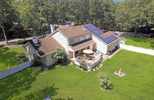 Manorville House | Manorville 4BR Home | Fenced Yard, Deck, Fireplace, Near East End Beaches