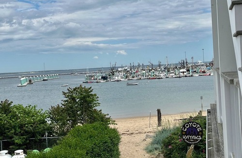 Commercial Street Condo | Modern beachfront condo with private deck, harbor views, and parking!
