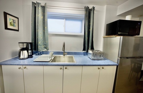 Laval-des-Rapides Apartment | Modern, cozy, 5 min walk to Metro, Place Bell, Free Parking