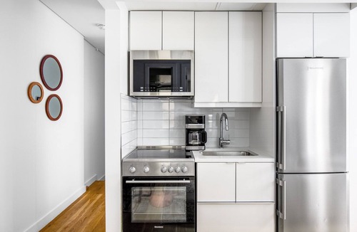 Little Italy Apartment | Modern Nolita 2BR w/W/D, large deck, easy walk to SoHo, by Blueground