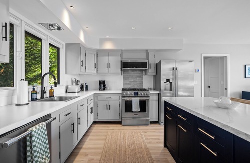 Guilford House | Modern Waterfront Oasis with Private Beach and Sunset Views