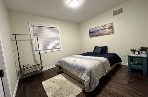 Grand River South House | Nice home with cozy living room, large backyard, bedroom and bathroom.