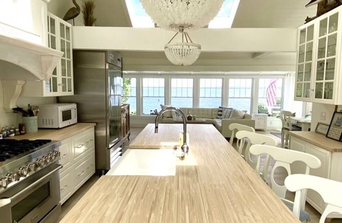 Bristol Cottage | Old fashioned designer front porch living by the sea with expansive water views.